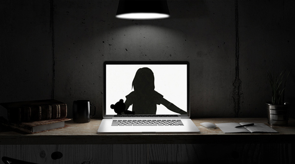 silhouette of child on computer screen